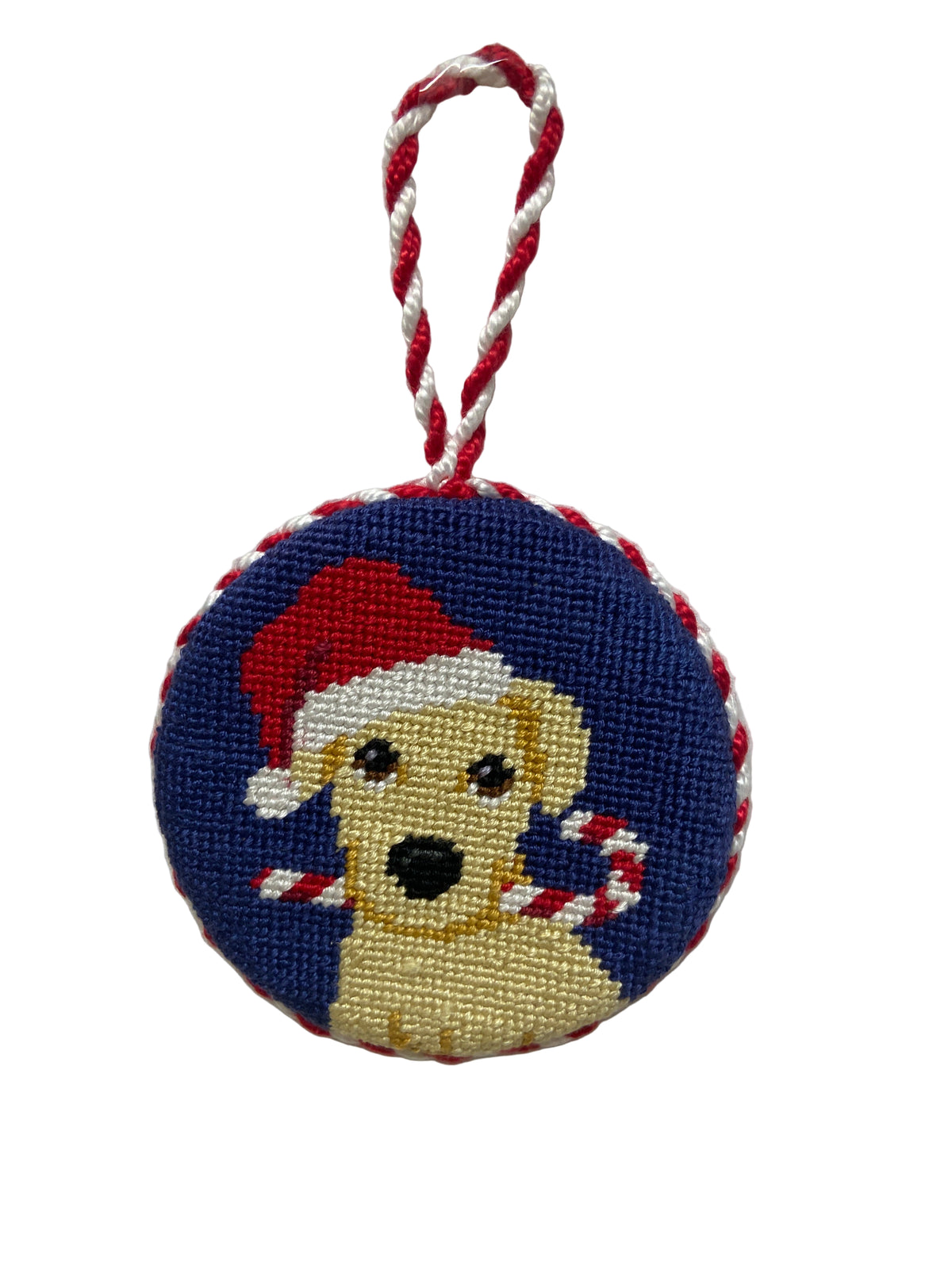 Round needlepoint ornament with a dog design on a white background