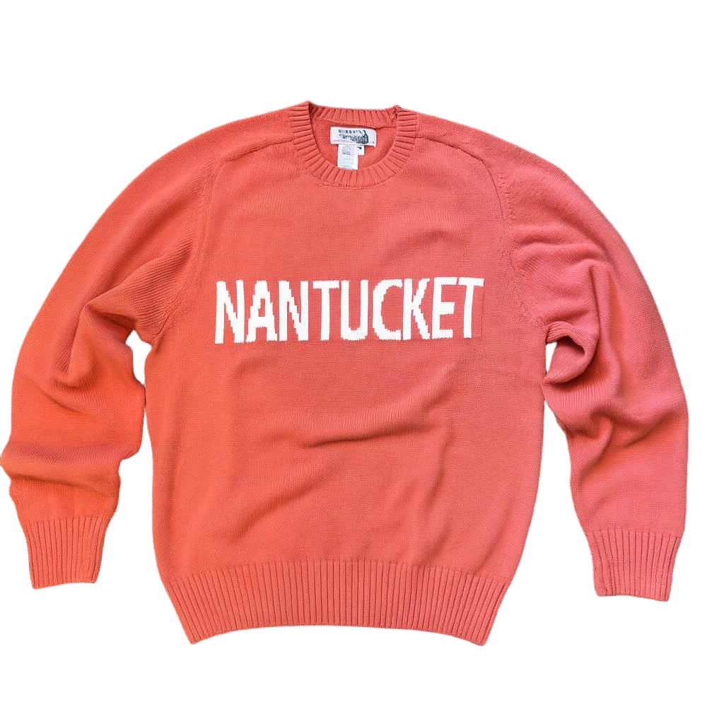 Pink sweater with 'NANTUCKET' text on a black background